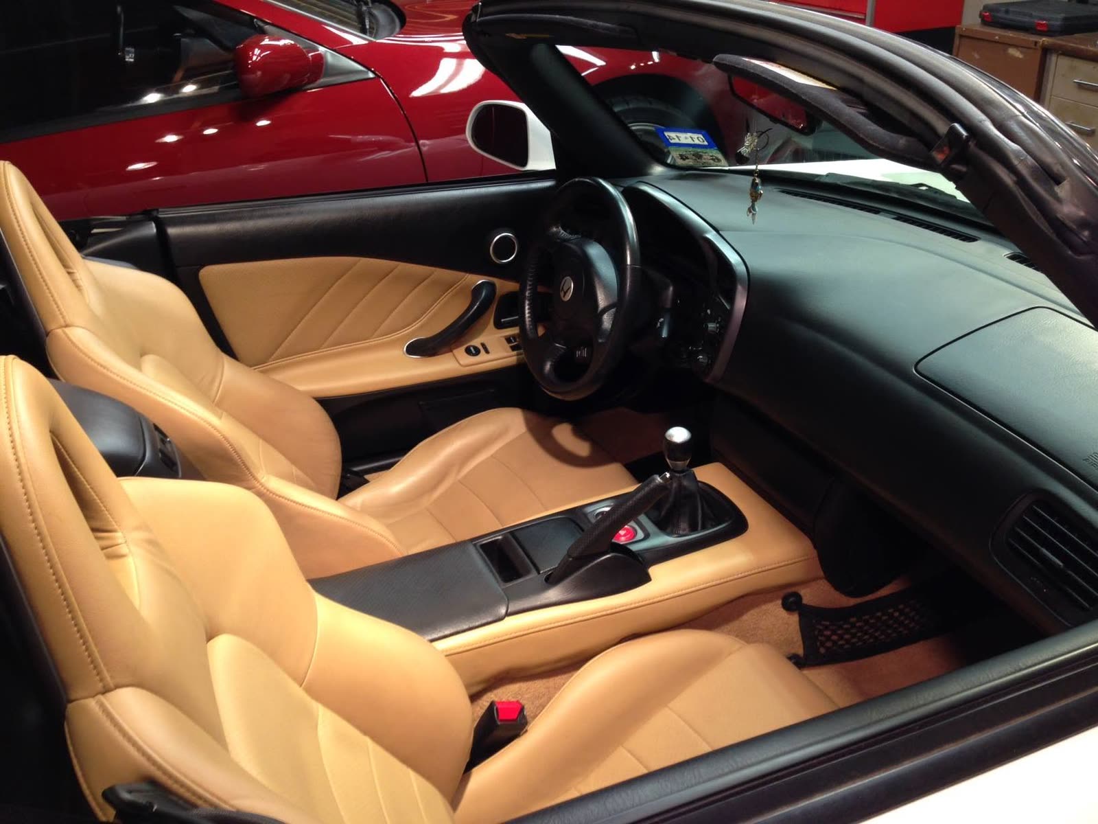 Tan leather interior of a Honda S2000 after cleaning