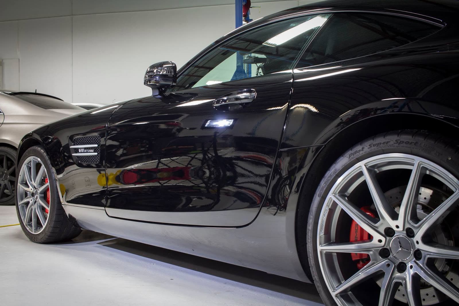 Side profile of a black Mercedes-AMG GT